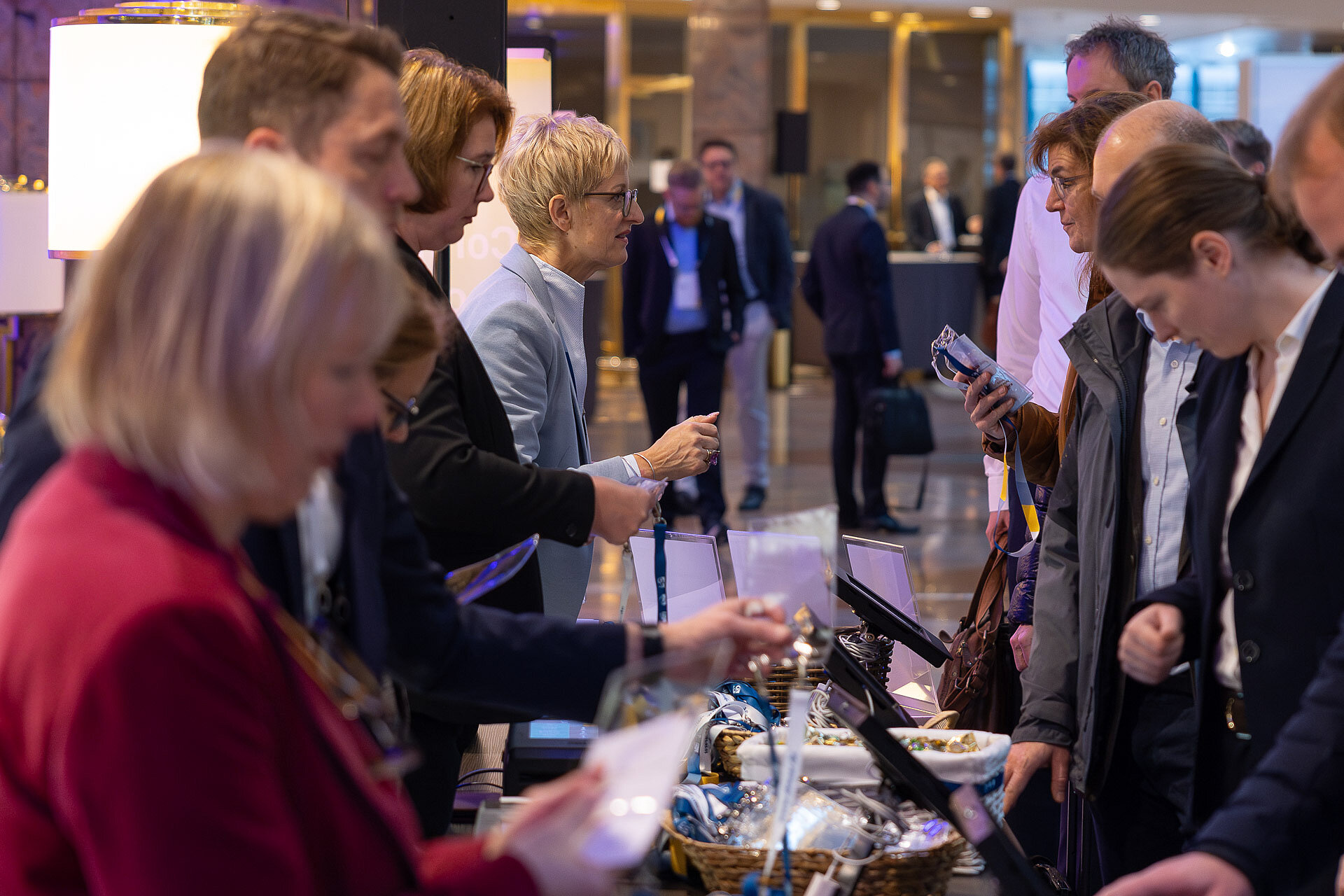 People at the registration desk for the 2023 autumn meeting 2023.
